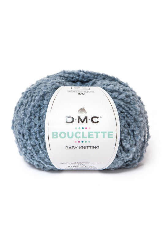Ovillo de 37% lana 36% poliamida y 27% acrílico de la marca DMC. El modelo es Bouclette en el color 007