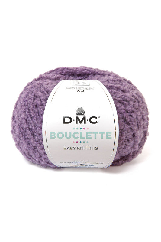 Ovillo de 37% lana 36% poliamida y 27% acrílico de la marca DMC. El modelo es Bouclette en el color 136