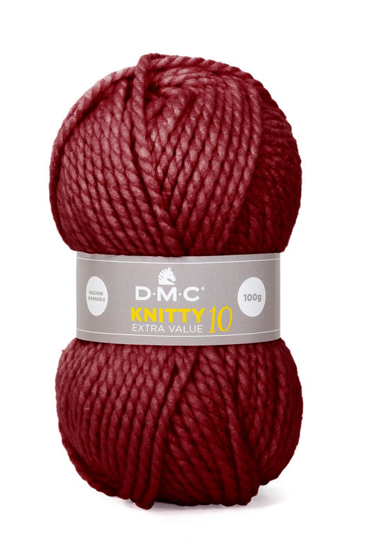 Ovillo de lana extragruesa 100% acrílico de la marca DMC. El modelo es Knitty 10 en el color 841/Burdeos